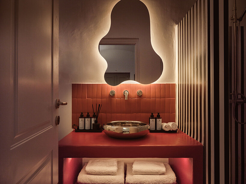 urban soul project redefines the santorini palette through bold red hotel design