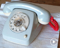vintage rotary telephone transforms into analog-digital hybrid music player and AI voice chat