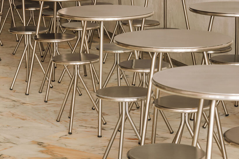 reflective steel interiors and open facade bring lisbon’s street activity into pizza restaurant