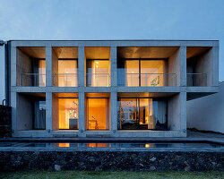 SO arquitetos builds coastal 'casa da rocha quebrada' as a grid of framed views