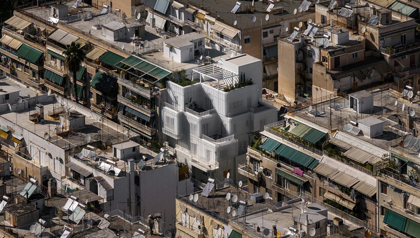 layered lightweight volumes by arid extend 1950s building in patissia, athens