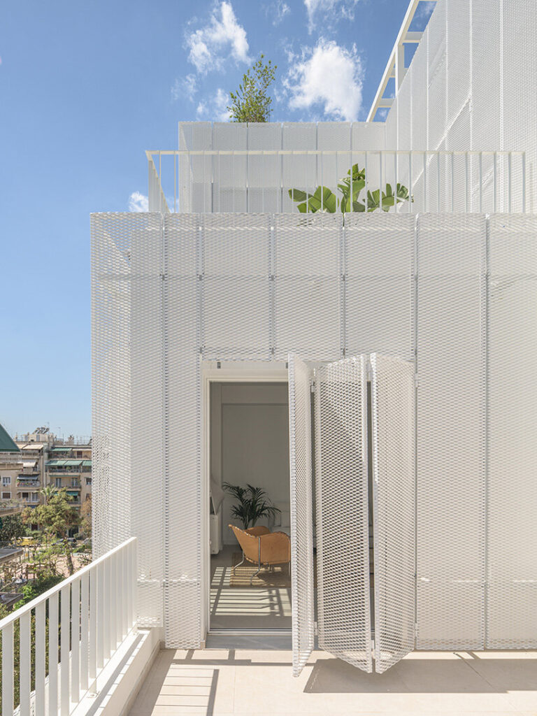 arid layers lightweight volumes atop 1950s building in athens