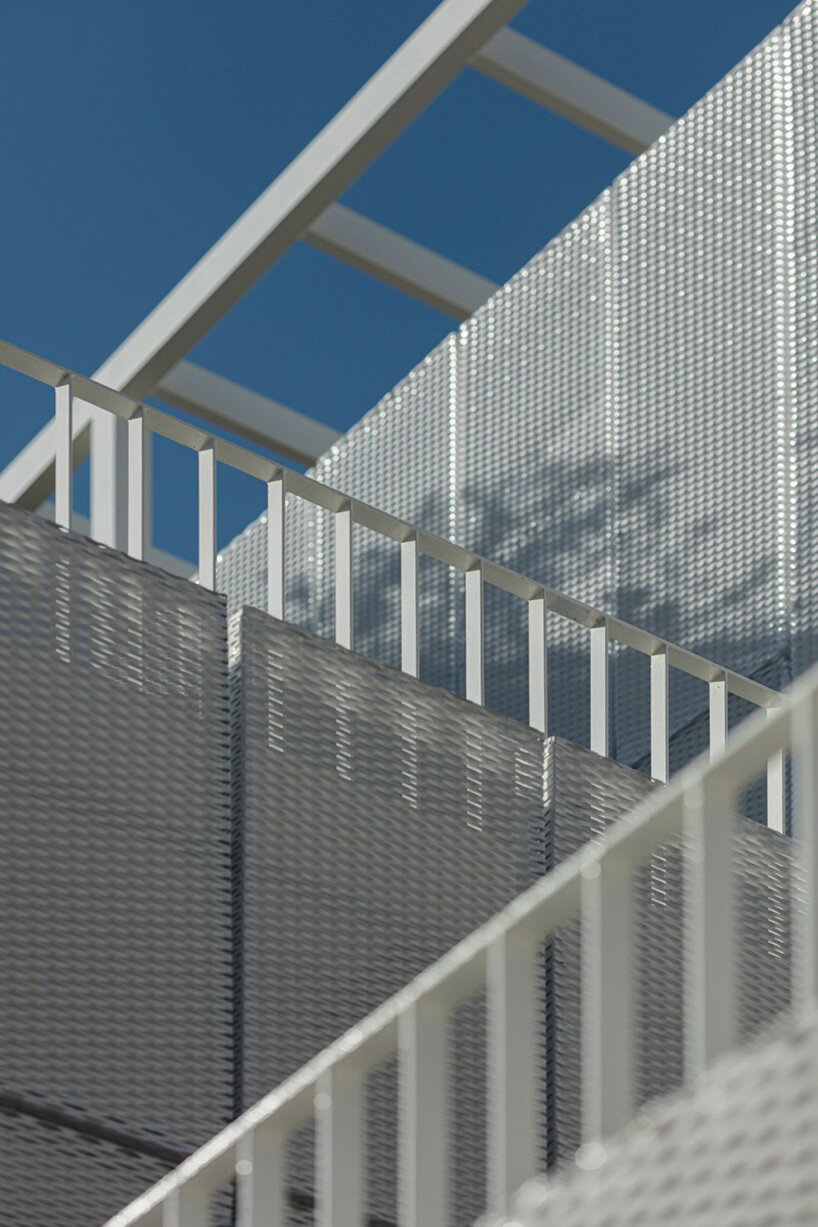 layered lightweight volumes by arid extend 1950s building in patissia, athens