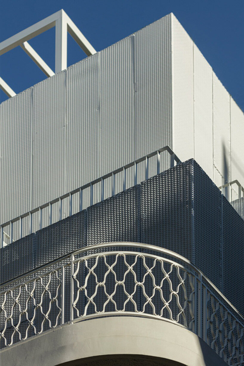 layered lightweight volumes by arid extend 1950s building in patissia, athens