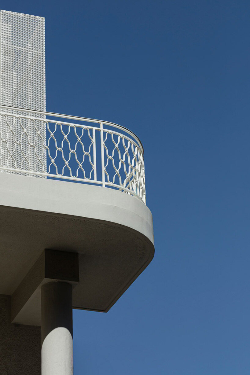 layered lightweight volumes by arid extend 1950s building in patissia, athens