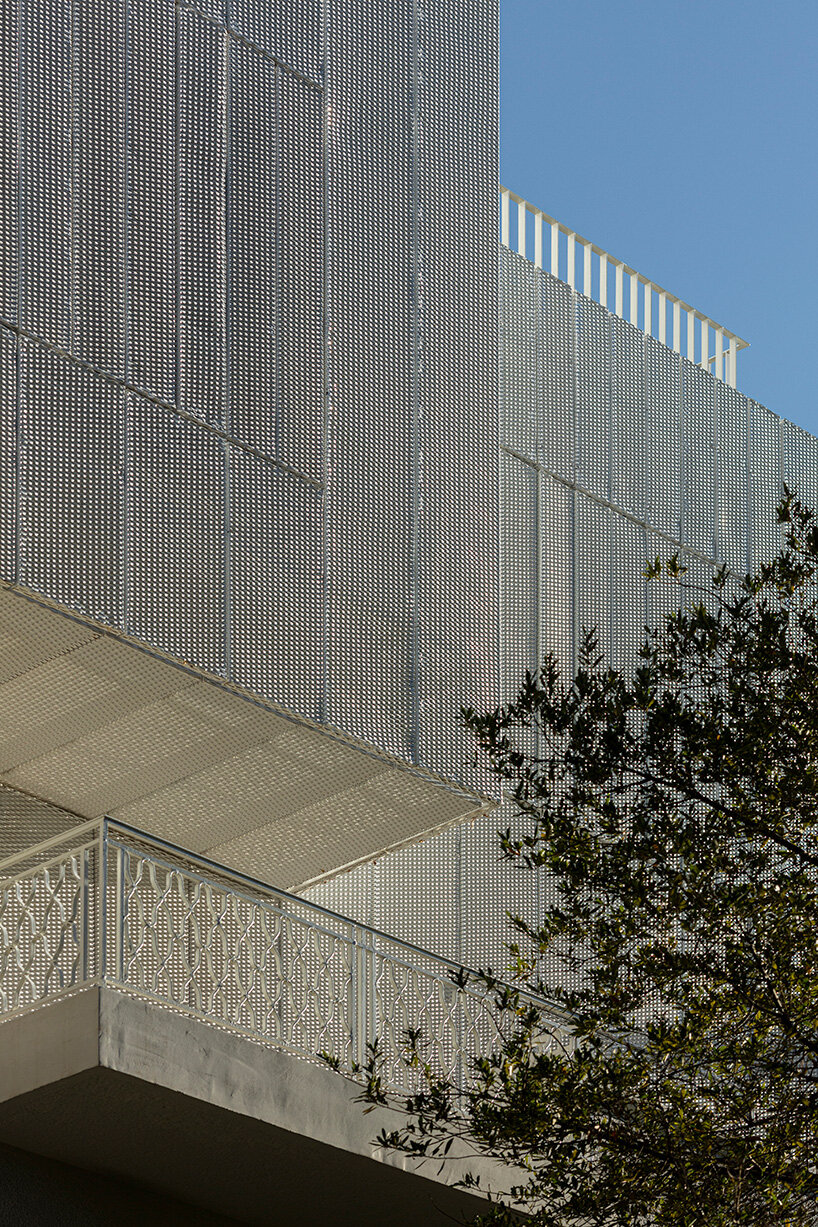 layered lightweight volumes by arid extend 1950s building in patissia, athens