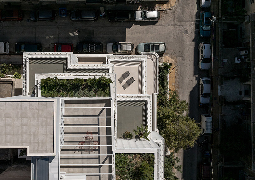 layered lightweight volumes by arid extend 1950s building in patissia, athens