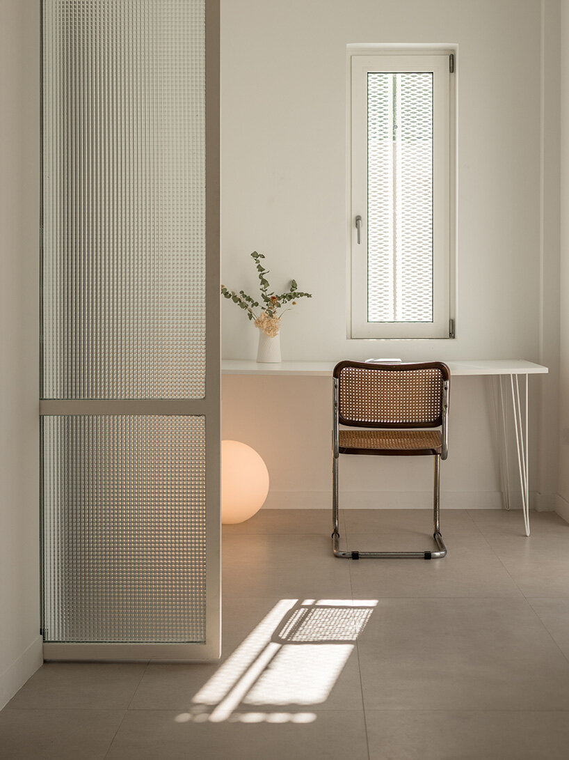 layered lightweight volumes by arid extend 1950s building in patissia, athens