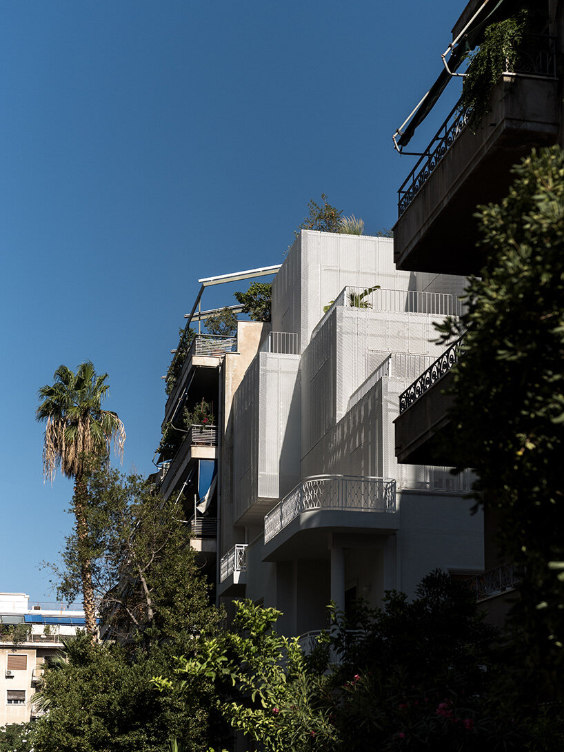 layered lightweight volumes by arid extend 1950s building in patissia, athens