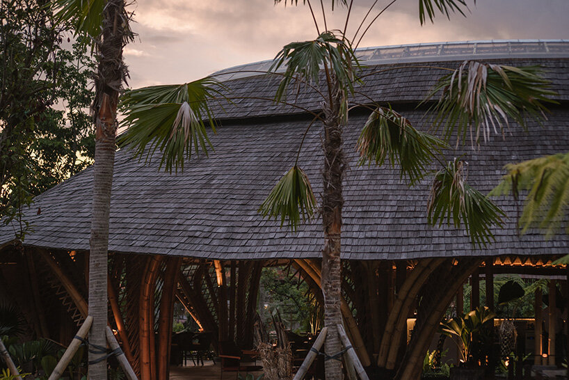 circular bamboo roof collects rainwater at balinese restaurant by pablo luna studio