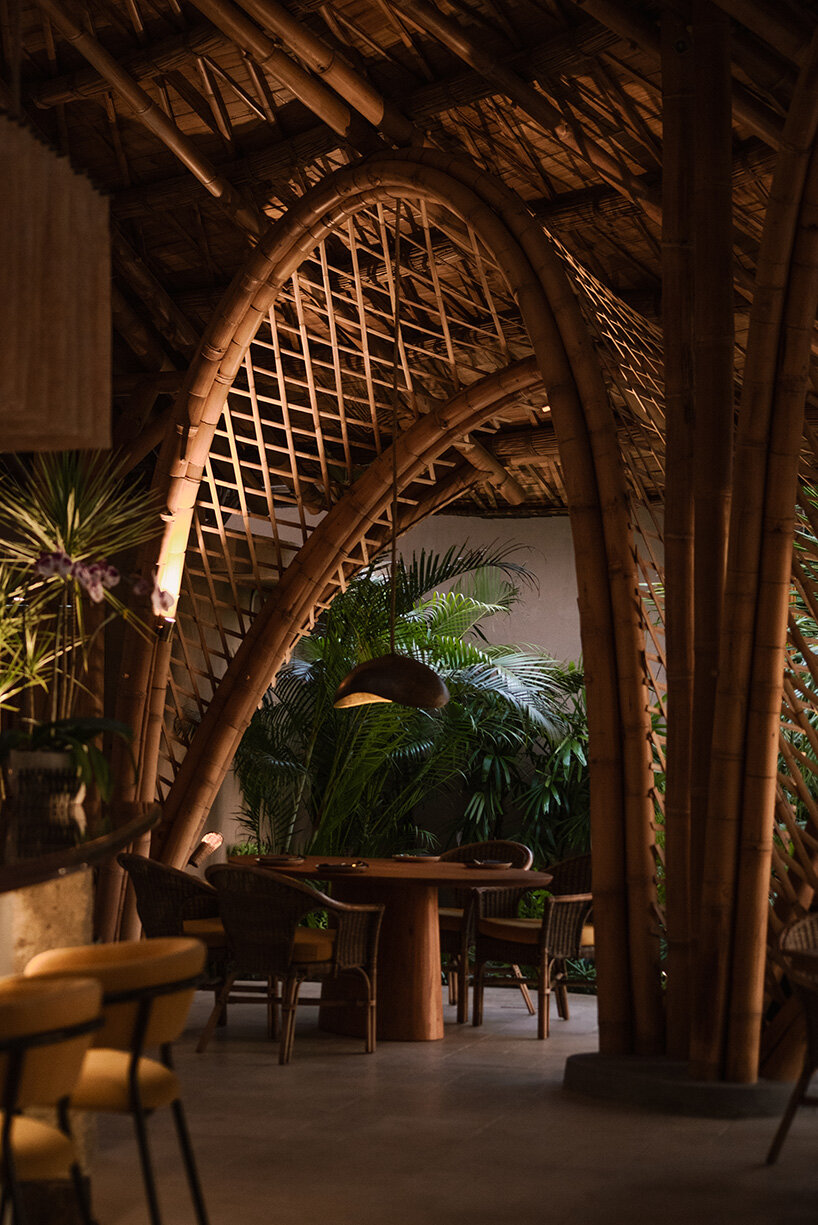 circular bamboo roof collects rainwater at balinese restaurant by pablo luna studio