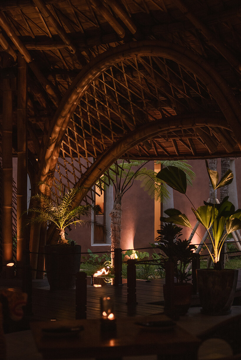 circular bamboo roof collects rainwater at balinese restaurant by pablo luna studio