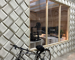 modular 3D printed facade wraps workspace in japan like knit textile