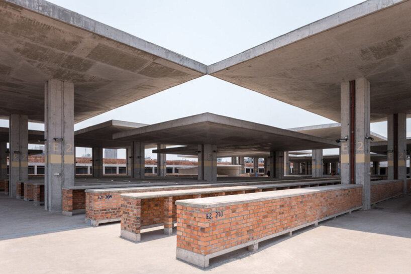 concrete canopies and porous brick walls form central market redevelopment in congo