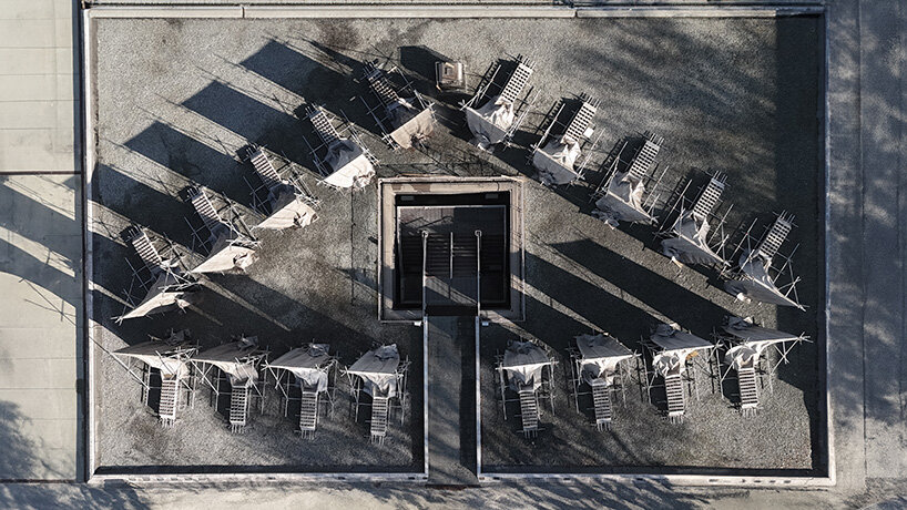 concrete canvas wraps 18 scaffolding monoliths for monumental installation in florence