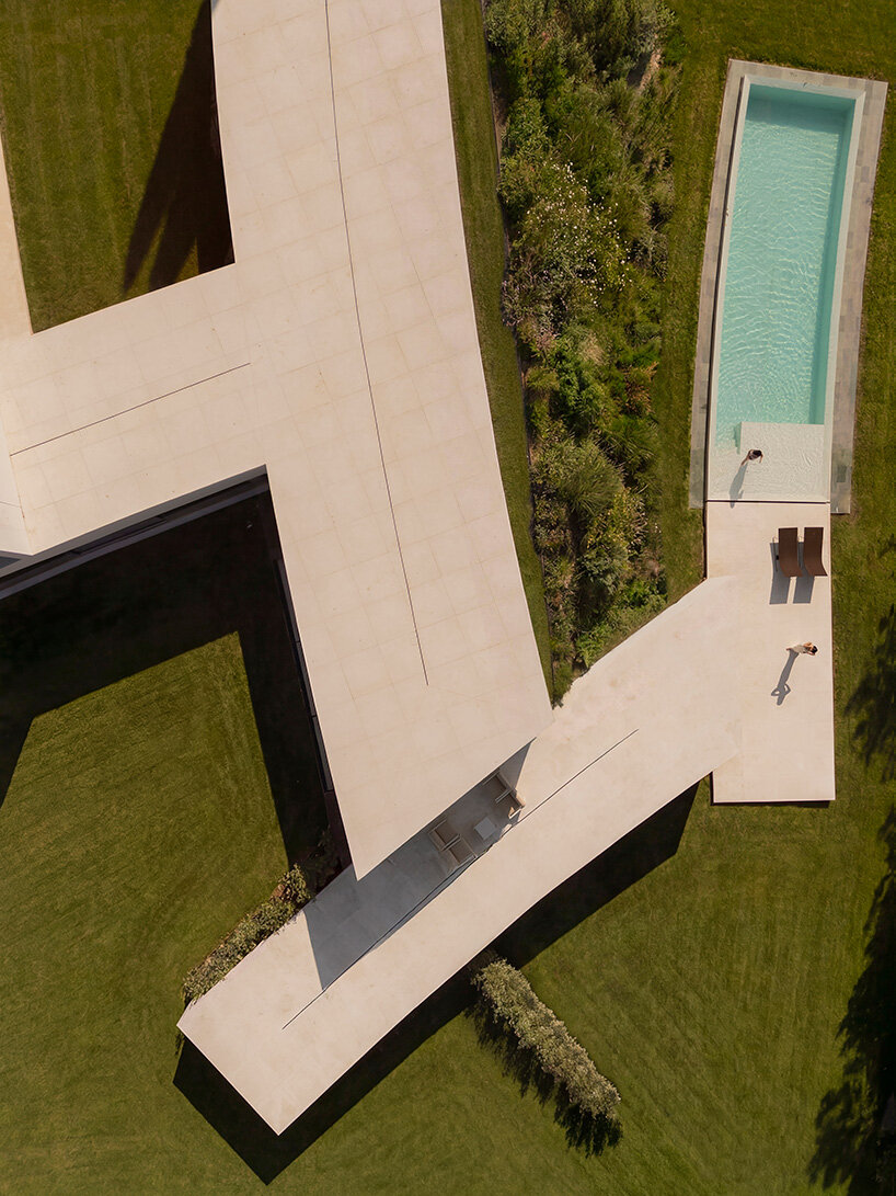 curved bodies organize sequence of gardens in spanish home by fran silvestre arquitectos
