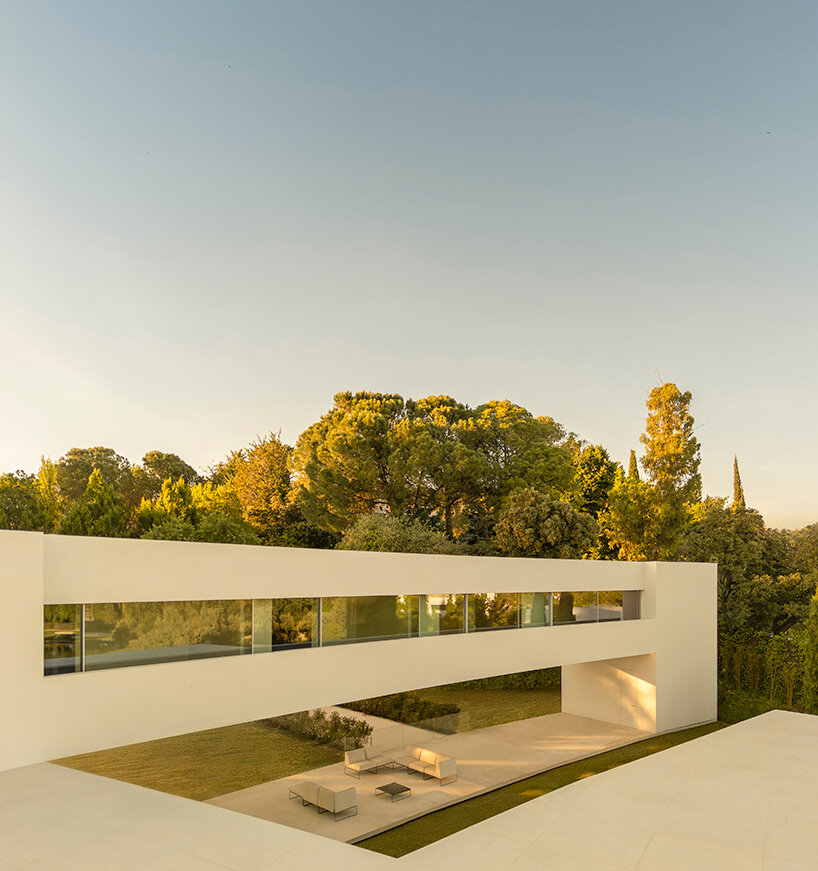 curved bodies organize sequence of gardens in spanish home by fran silvestre arquitectos