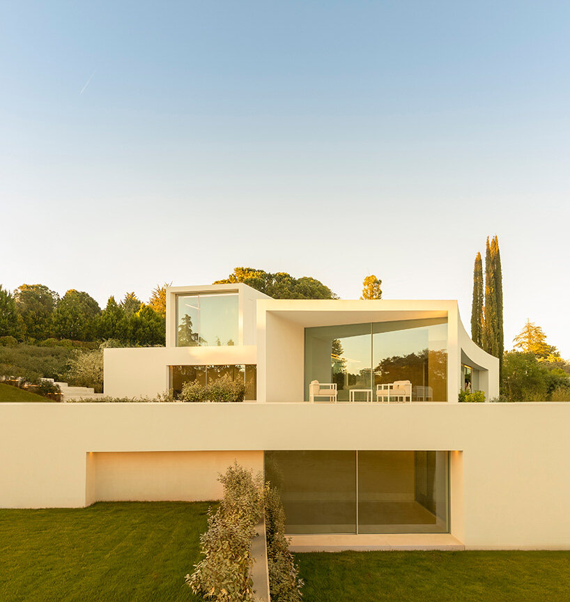 curved bodies organize sequence of gardens in spanish home by fran silvestre arquitectos
