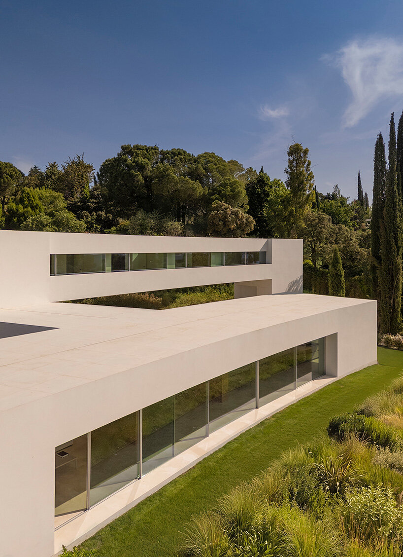 curved bodies organize sequence of gardens in spanish home by fran silvestre arquitectos