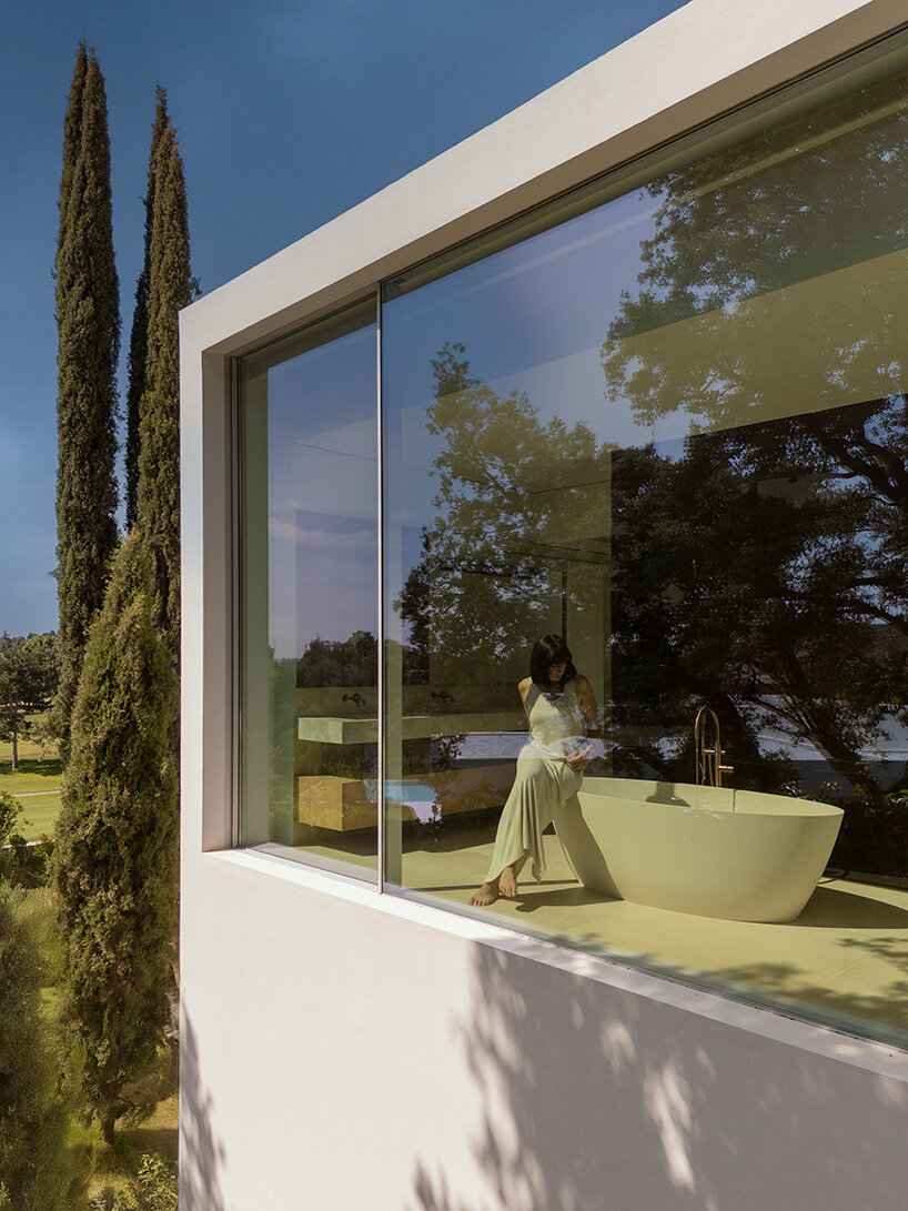 curved bodies organize sequence of gardens in spanish home by fran silvestre arquitectos