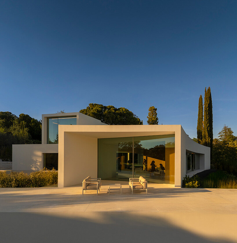curved bodies organize sequence of gardens in spanish home by fran silvestre arquitectos