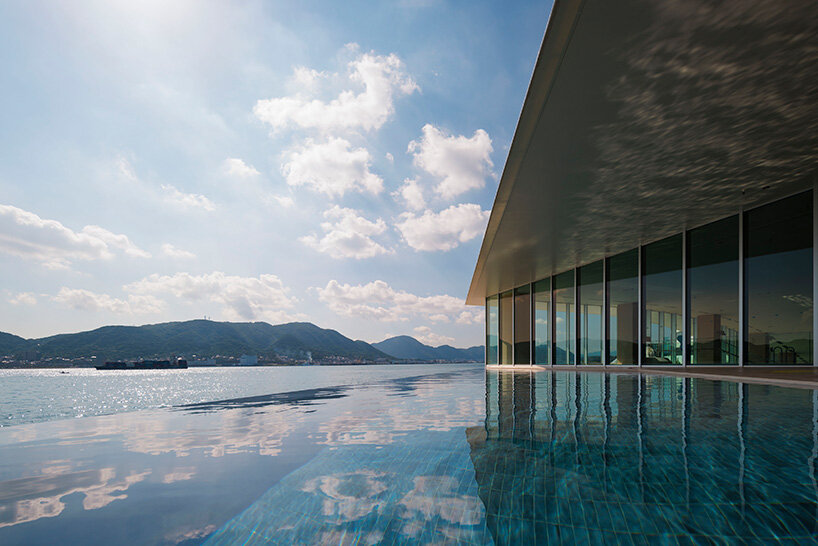 curved twin volumes shape the risonare shimonoseki hotel along japan's kanmon strait - 7