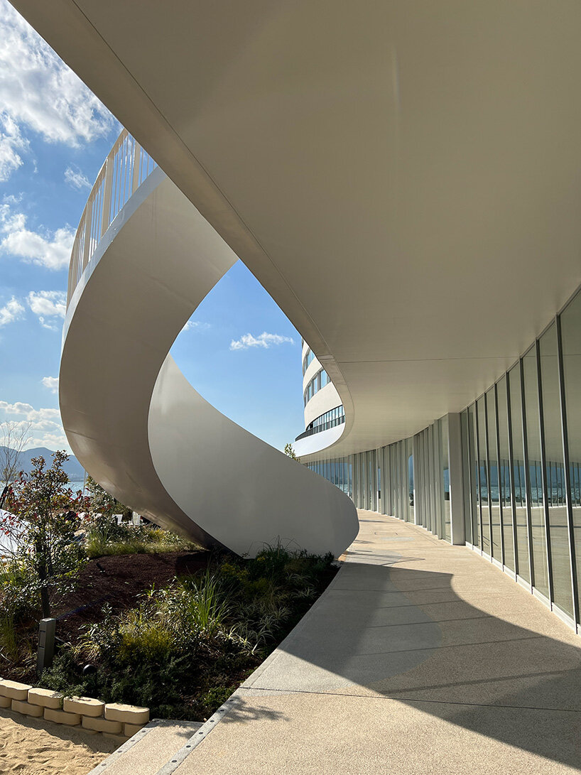 curved twin volumes shape the risonare shimonoseki hotel along japan's kanmon strait - 6