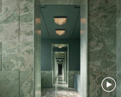 green marble clads gallery showroom’s immersive interiors in shenzhen