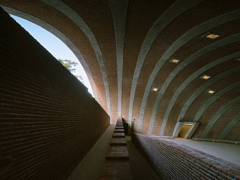 earth-covered domes and brick vaults shape liberation museum of manisa in turkey