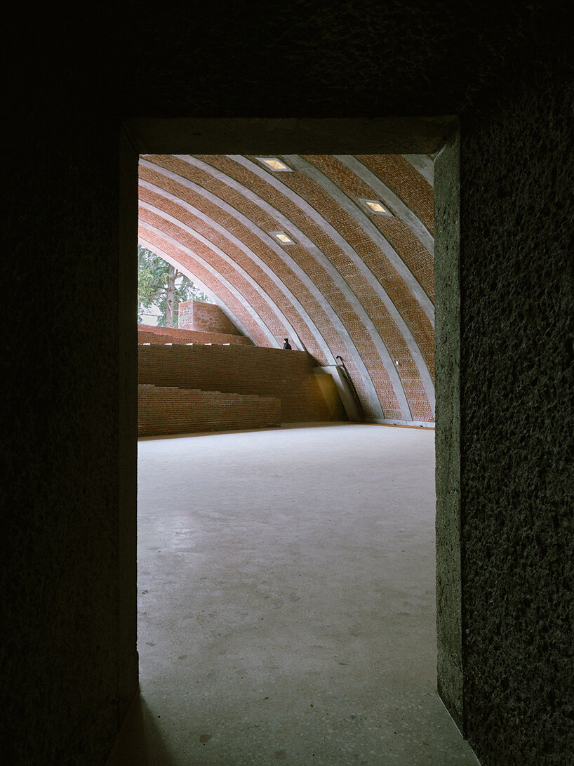 earth-covered domes and brick vaults shape liberation museum of manisa in turkey
