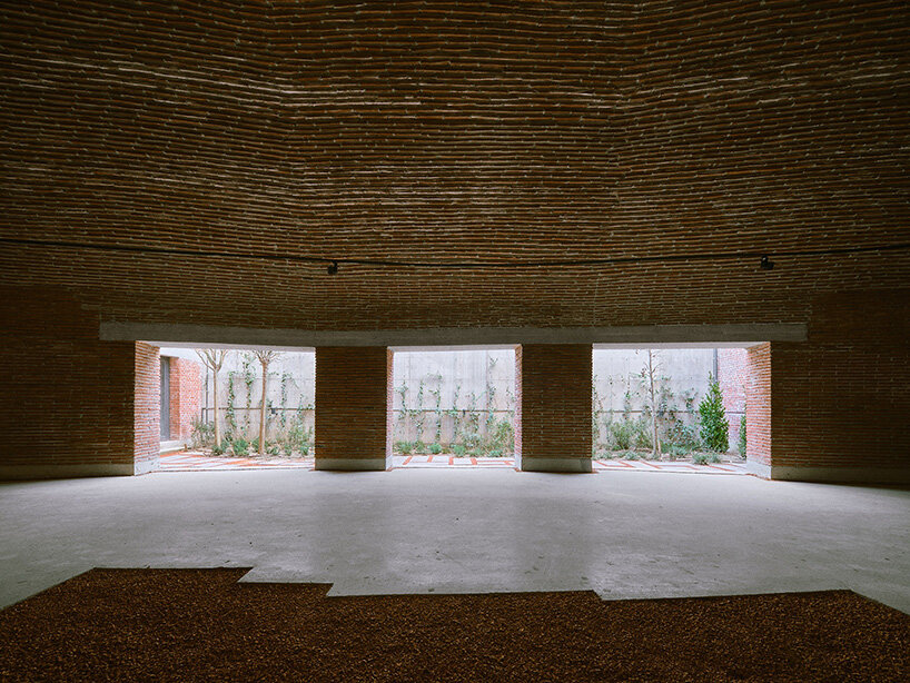earth-covered domes and brick vaults shape liberation museum of manisa in turkey