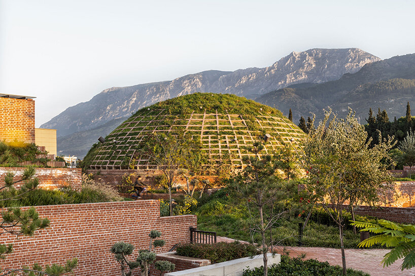 earth-covered domes and brick vaults shape liberation museum of manisa in turkey