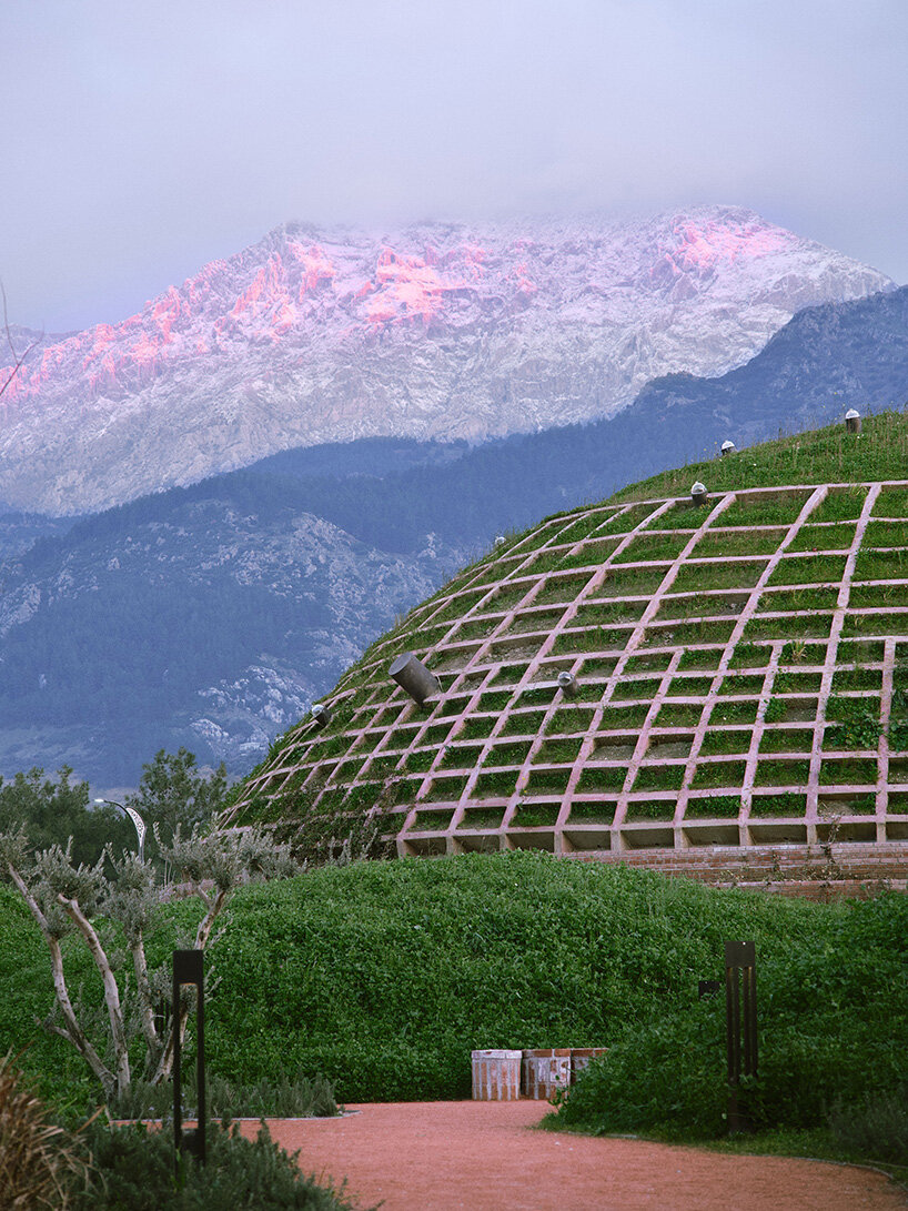 earth-covered domes and brick vaults shape liberation museum of manisa in turkey