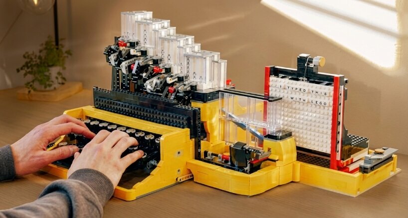 when the key is pressed, it releases one letter tile from a vertical magazine using gravity