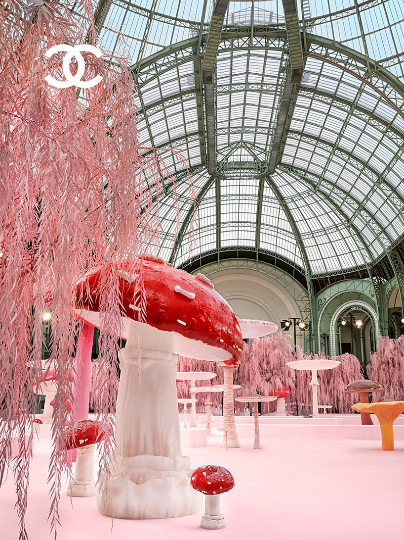 giant mushrooms populate dreamlike forest set inside the grand palais for chanel show