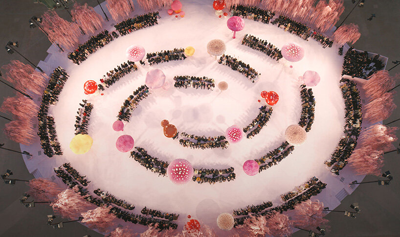 giant mushrooms populate dreamlike forest set inside the grand palais for chanel show