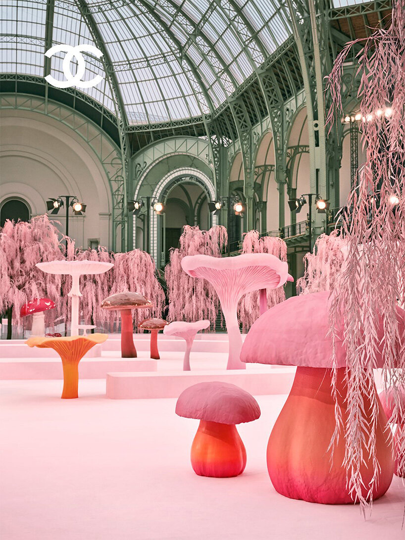 giant mushrooms populate dreamlike forest set inside the grand palais for chanel show