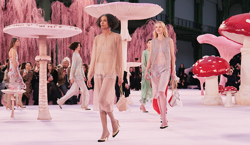 giant mushrooms populate dreamlike forest set inside the grand palais for chanel show