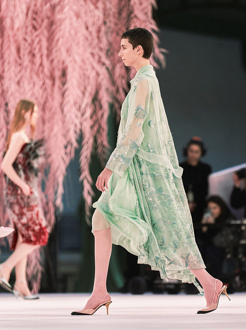 giant mushrooms populate dreamlike forest set inside the grand palais for chanel show