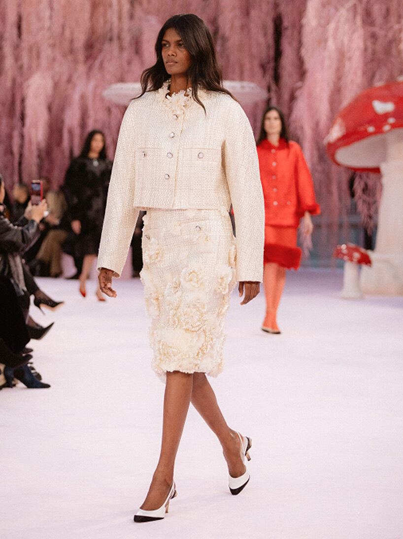 giant mushrooms populate dreamlike forest set inside the grand palais for chanel show
