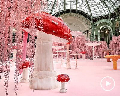 giant mushrooms populate dreamlike forest set inside the grand palais for chanel show