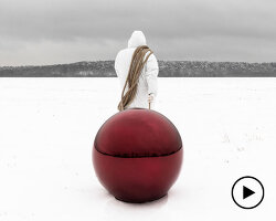 reflective red sphere represents the world in gregory orekhov’s land art installation