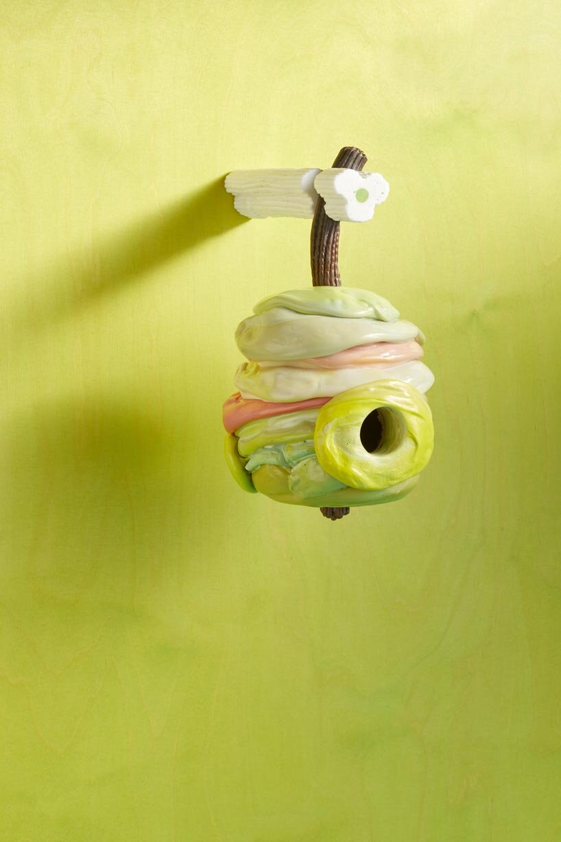 over 75 birdhouse designs explore the concept of home at MAD brussels exhibition