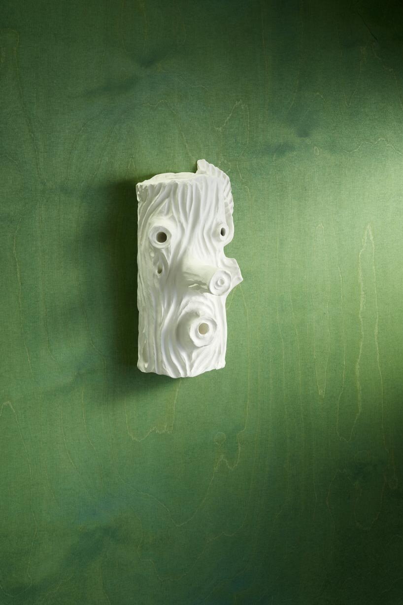 over 75 birdhouse designs explore the concept of home at MAD brussels exhibition