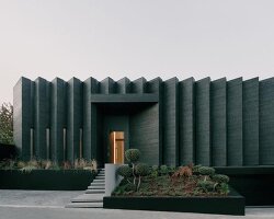 serrated charred wood shell encloses suburban residence on the hills of tbilisi