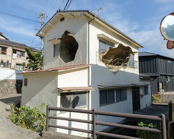 irregular voids reveal cave-like, geological interior inside japanese residence