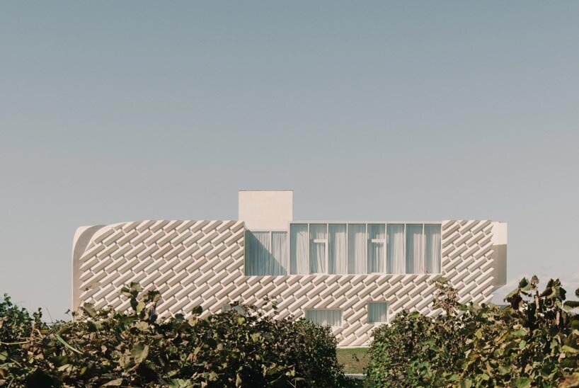 arches and voids carve winery&rsquo;s monolithic white facade in georgia
