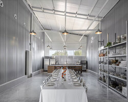 corrugated metal interiors reinvent vegetable storage fridge into industrial hospitality space