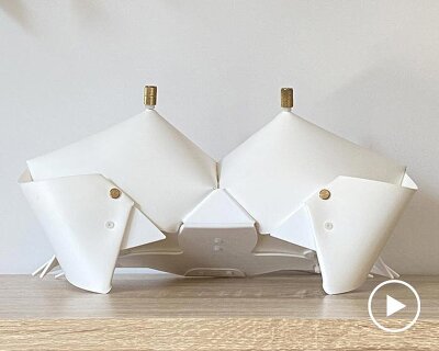 origami crab lamp folds into a softly glowing nightstand companion