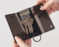 wearable collection repurposes leftover leather powder as translucent composite material